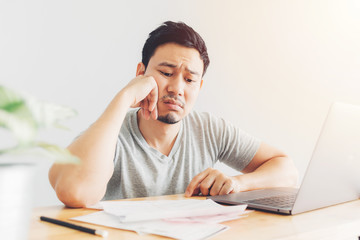 Sad man has problems with billing and debts.