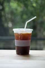 Iced americano coffee on wood table