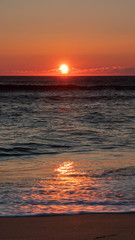 Serene coastal sunrise in the Outer Banks of North Carolina. Peaceful morning view with sunlight...
