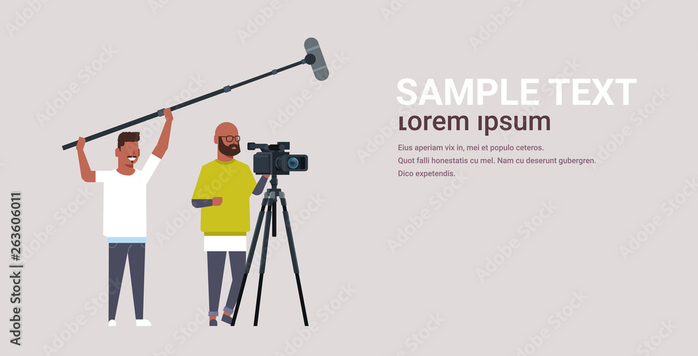 Poster operators using video camera on tripod holding microphone african american men working with professi