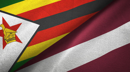 Zimbabwe and Latvia two flags textile cloth, fabric texture