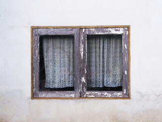 Close up vintage wooden window with old curtain