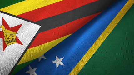 Zimbabwe and Solomon Islands two flags textile cloth, fabric texture