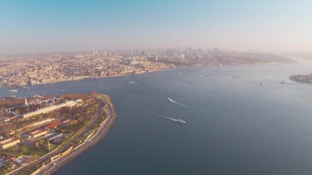 Drone video of Istanbul Turkey in the Sultanahmet area with touristic mosques (hagia Sophia, aya sofia, blue mosque and the bosphorus with a view to the European and Asean sides on a sunny morning.
