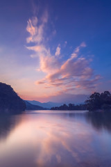 Fototapeta na wymiar Reflection of clouds sunset