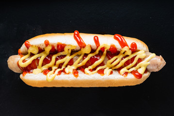 hot dog on the black background