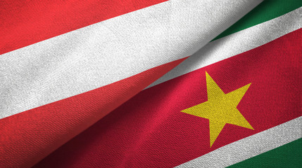 Austria and Suriname two flags textile cloth, fabric texture