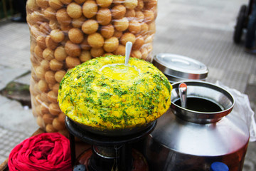 Close-up of pani puri stall, typical Indian snack, Pune, Maharashtra. © RealityImages