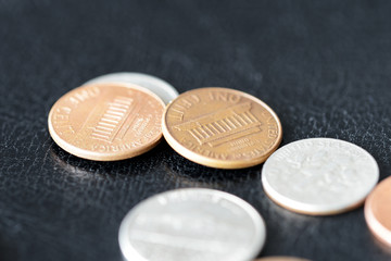 American cents on a dark surface close up