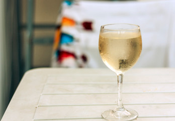 glass of white wine on wooden tableю