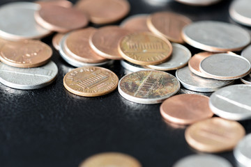 American cents on a dark surface close up
