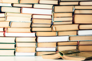 Books background, open book on white wooden table in office for education learning concept.