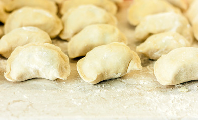 Fototapeta na wymiar Preparing, cooking, making homemade dumplings with cabbage.