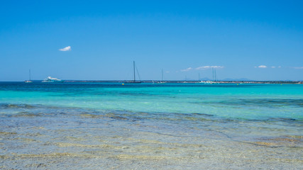 Colonia Sant Jordi, Ses Salines, Spain. Amazing view of the boats in turquoise sea close to the...