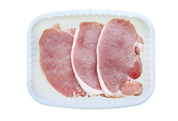 Chopped raw pork tenderloin on white plastic tray isolated on white background