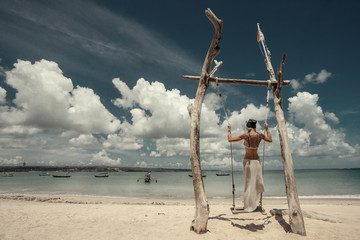 Hanging swing on the sea