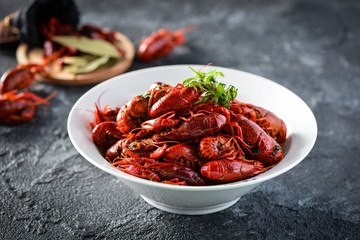 Red spicy crayfish in a white dish