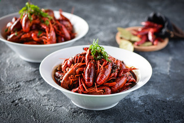 Red spicy crayfish in a white dish