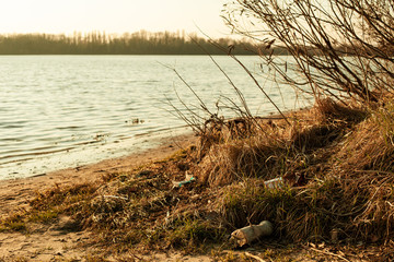 Photo showing the attitude of people to nature, discarded garbage on the beach