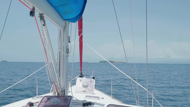 Slow Motion: Close-Up of Yacht Prow on Blue Ocean with Islands Ahead in El Limon, Dominican Republic