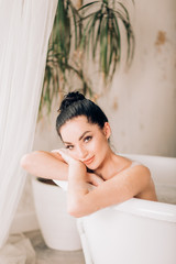 Beautiful sexy woman in bubble bathtub