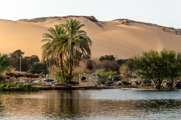 Sunset, Sand dunes on the Coastline of the Nile river part called First Cataract, Aswan Egypt
