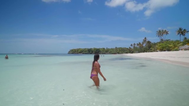 Slow Motion: Beautiful Young Woman in Bikini Standing in Clear Tropical Ocean in El Limon, Dominican Republic