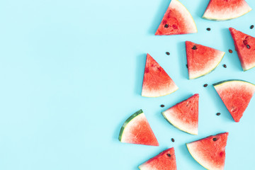 Watermelon pattern. Red watermelon on blue background. Summer concept. Flat lay, top view, copy space - 263626011