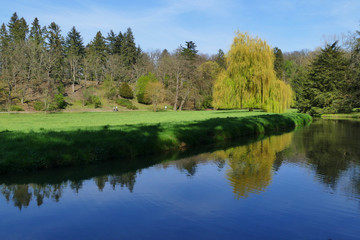 Fototapeta na wymiar Pruhonicky award winning park with Botic river, Prague, Czech Republic