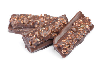 Small chocolate covered cakes with crushed nuts