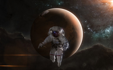 Astronaut on background of Mars. Red Planet, Solar System. Science fiction art. Elements of the...
