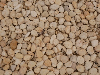 white pebbles on the beach stone background