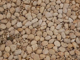 white pebbles on the beach stone background