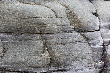 Stone surface texture with straight lines dashed.