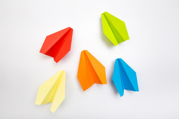 Colorful paper plane on white background, Business competition concept