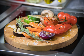 Served fried vegetables on the wooden desk on the kitchen
