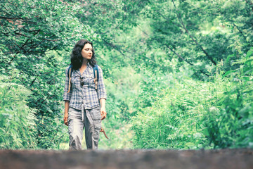 Traveling woman walking along the road