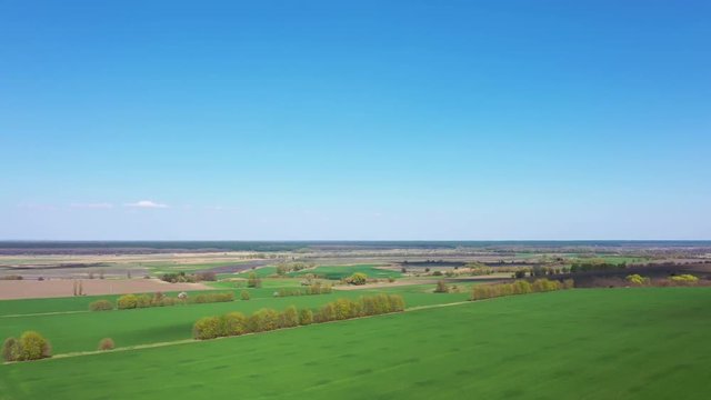 Aerial Europe Valley Farming crops agricultural arable farmland vegetation water field industry investment nature, early spring.