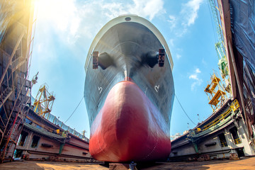 bulk head of the commercial ship in floating dry dock for painting , repairing, recondition, sand...