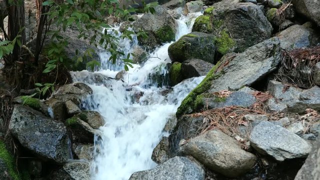 A natural waterfall filmed in Yosemite CA during spring of 2019 caused by melting snow.