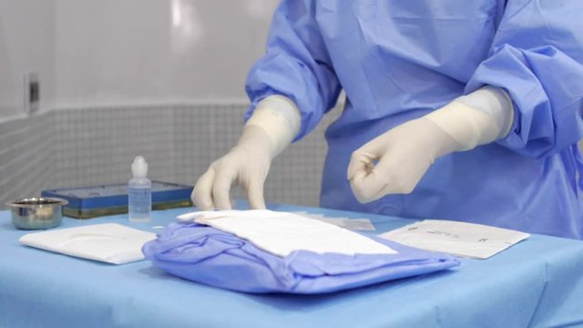 Nurse Preparing Medical Instruments Before the Surgery.