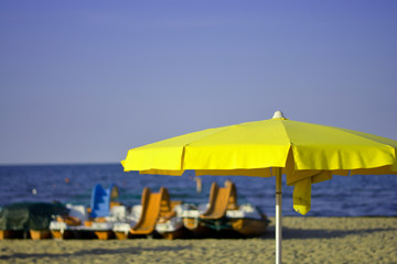 yellow umbrellas on the beach