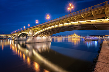 Fototapeta na wymiar Margaret Bridge with the Parliament in Budapest