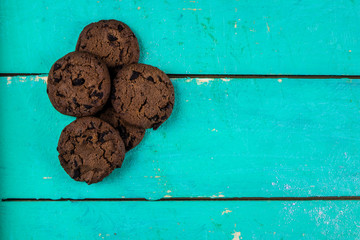 Chocolate chip cookies on wooden background