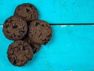 Chocolate chip cookies on wooden background