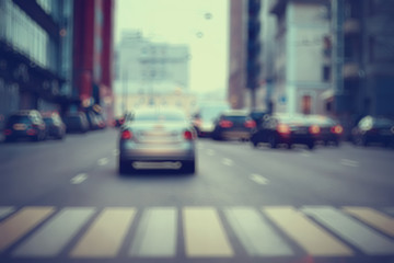 view of car in  traffic jam / rear view of the landscape from window in car, road with cars, lights and the legs of the cars  night view