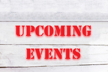 upcoming events on white wooden table