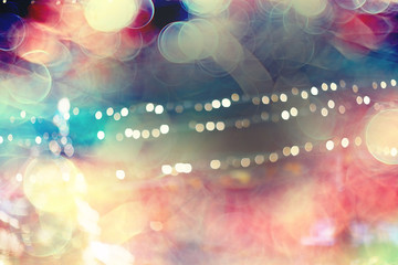 blurred bokeh city background / glare and glowing light in night city, modern beautiful bright...