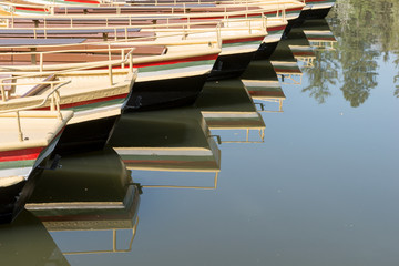 Empty gondolas waiting for customers on the lake