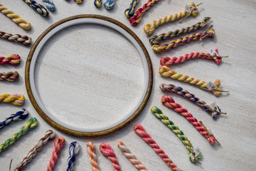 The embroidery hoop with canvas and bright sewing. Creative concept with copy space